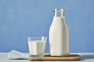 AI generated A bottle of milk and a glass of milk on a wooden table on a blue background. AI Generated photo