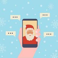 Kid making video call with Santa Claus during Xmas. Hand holding smartphone. Chatting online using mobile app during pandemia for Christmas. Vector illustration with winter snowing background.