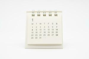 Simple desk calendar with no year isolated on white background. Calendar concept with copy space. photo