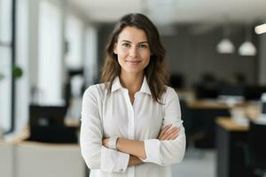 AI generated Portrait of successful and happy businesswoman, office worker smiling and looking at camera with crossed arms, working inside modern office. photo