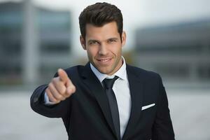 AI generated young smiling man in formal wear pointing with finger on you photo