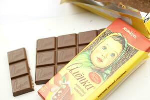 KHARKIV, UKRAINE - JANUARY 27, 2021 Alyonka chocolate square bars - product from Red October chocolate factory photo