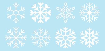 linda copos de nieve colección aislado en azul antecedentes. plano nieve iconos, silueta. vector