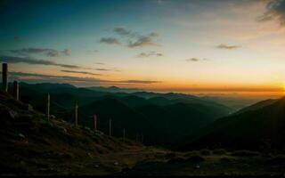 ai generado crepúsculo abrazo un sinfonía de colores terminado majestuoso montaña picos ai generado foto