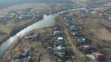 View from the top of the village. Streets without asphalt and single-storey houses. The Kuban village. photo