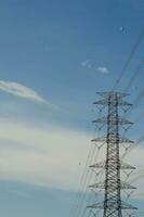 High Voltage Pole with Blue Sky photo