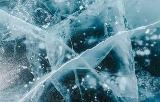 Beautiful cracks surface of the frozen lake of Baikal lake with frost methane bubbles in winter season. photo