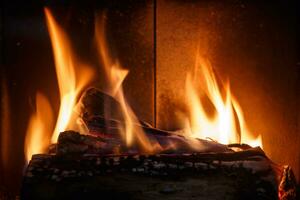 Fireplace with burning wood photo