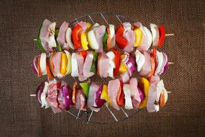 Raw pork skewers ready for grilling photo