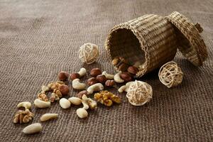 Almonds, cashew, walnuts and hazelnuts lying on burlap photo