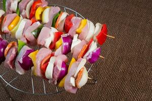 Raw pork skewers ready for grilling photo