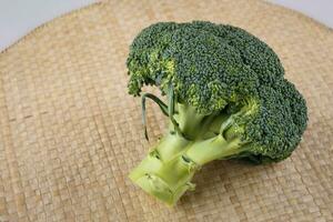 Fresh broccoli on table photo