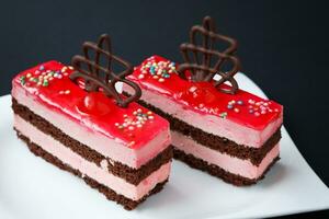 Sweet colorful desserts on a black background photo