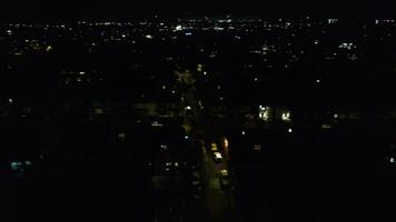 Aerial View of Illuminated City During Dark Night and Live Fireworks on New Year's Night over Luton, England UK. January 1st, 2024 video