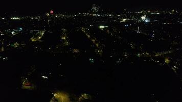 Aerial View of Illuminated City During Dark Night and Live Fireworks on New Year's Night over Luton, England UK. January 1st, 2024 video