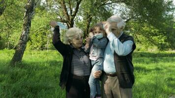 Family of grandparents takes off medical masks after coronavirus quarantine end video