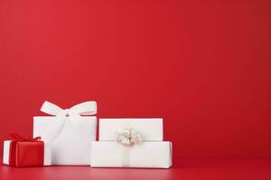 AI generated white gift boxes with silk ribbon bows and golden confetti on isolated red background photo