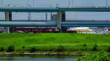 A timelapse of traffic jam at the downtown street and highway telephoto shot panning video