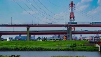 A timelapse of traffic jam at the downtown street and highway telephoto shot tilt video