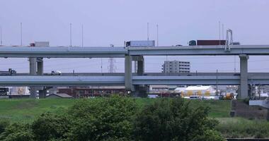 A traffic jam at the downtown street and highway telephoto shot video