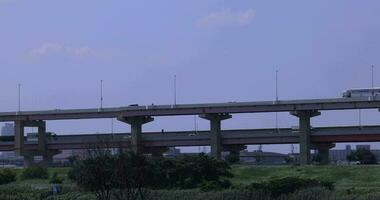 A traffic jam at the downtown street and highway telephoto shot video