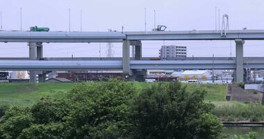 A traffic jam at the downtown street and highway telephoto shot video