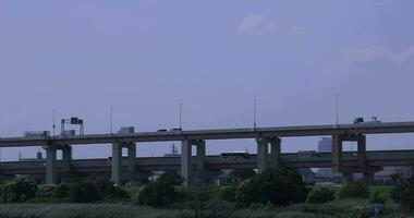 A traffic jam at the downtown street and highway telephoto shot video