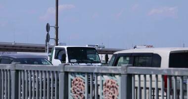 A traffic jam at the downtown street and highway telephoto shot video