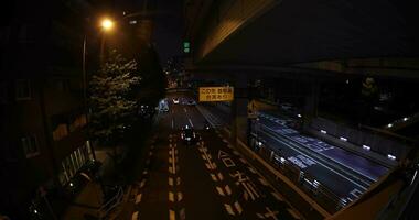 A night traffic jam at the city street in Tokyo fish eye shot video