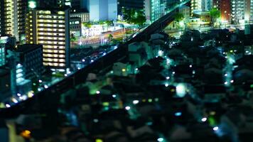 A night timelapse of miniature cityscape in Osaka high angle tilt video