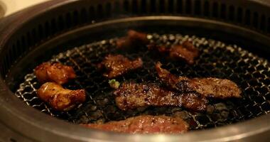 Japanese style bbq Yakiniku with Wagyu beef sliced close up handheld shot video