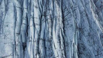 Flight over the Svnafellsjkull Glacier in Iceland. Skaftafell National Park. Ice and ashes of the volcano texture landscape, beautiful nature ice background from Iceland video