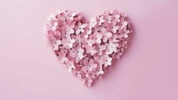 AI generated Heart shape made of pink flowers against pastel pink background photo