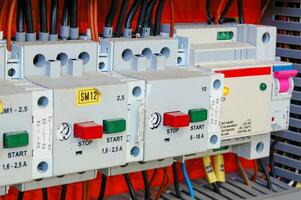 Electrical equipment. Automatic circuit breakers in a row. Electric switches in fusebox. photo