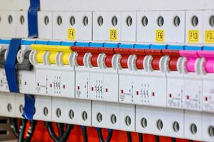 Electrical equipment. Automatic circuit breakers in a row. Electric switches in fusebox. photo