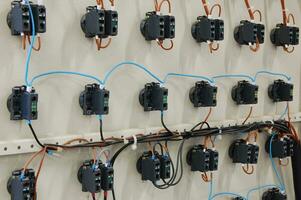 Electrical equipment. Automatic circuit breakers in a row. Electric switches in fusebox. photo