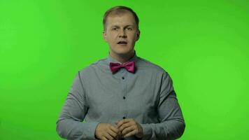 Expressive man screaming and shouting. Studio portrait of handsome person on chroma key video