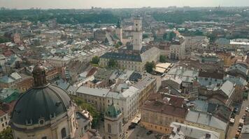Aerial drone video of european city Lviv, Ukraine. Rynok Square, Central Town Hall, Dominican Church