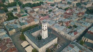 Aerial drone video of european city Lviv, Ukraine. Rynok Square, Central Town Hall, Dominican Church