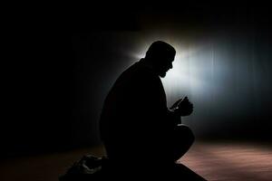 AI generated silhouette muslim man praying n the mosque photo