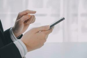 Young woman using apps on a mobile touchscreen smartphone. Concept for using technology, shopping online, mobile apps, texting, addiction, swipe up, swipe down. photo