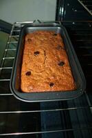 Banana bread with raisins in oven 6 photo