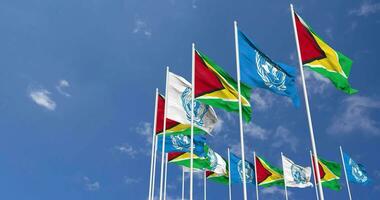 Guyana and United Nations, UN Flags Waving Together in the Sky, Seamless Loop in Wind, Space on Left Side for Design or Information, 3D Rendering video