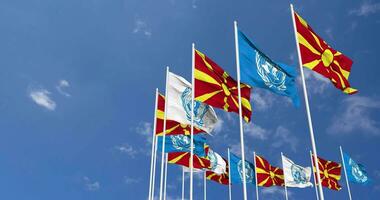 North Macedonia and United Nations, UN Flags Waving Together in the Sky, Seamless Loop in Wind, Space on Left Side for Design or Information, 3D Rendering video