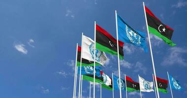 Libia y unido naciones, Naciones Unidas banderas ondulación juntos en el cielo, sin costura lazo en viento, espacio en izquierda lado para diseño o información, 3d representación video
