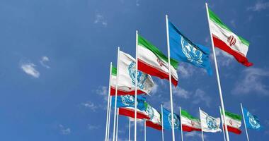 Iran and United Nations, UN Flags Waving Together in the Sky, Seamless Loop in Wind, Space on Left Side for Design or Information, 3D Rendering video