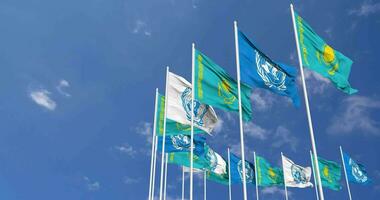 Kazakhstan and United Nations, UN Flags Waving Together in the Sky, Seamless Loop in Wind, Space on Left Side for Design or Information, 3D Rendering video