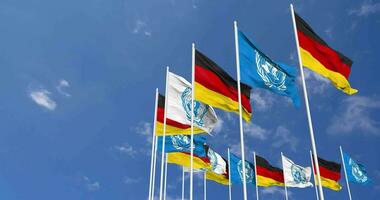 Germany and United Nations, UN Flags Waving Together in the Sky, Seamless Loop in Wind, Space on Left Side for Design or Information, 3D Rendering video