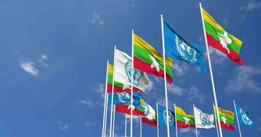 Myanmar, Burma and United Nations, UN Flags Waving Together in the Sky, Seamless Loop in Wind, Space on Left Side for Design or Information, 3D Rendering video