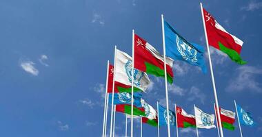 Oman and United Nations, UN Flags Waving Together in the Sky, Seamless Loop in Wind, Space on Left Side for Design or Information, 3D Rendering video